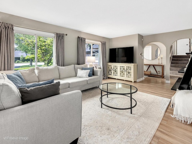 624 63rd St, Downers Grove, IL 60516 - living area with light wood-type flooring, arched walkways, and stairway