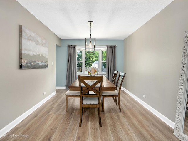 624 63rd St, Downers Grove, IL 60516 - dining space featuring light wood-style flooring and baseboards