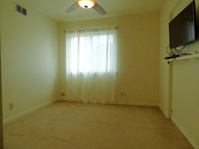 432 Thunder Rdg, Lake In The Hills, IL 60156 - spare room featuring light carpet and a ceiling fan