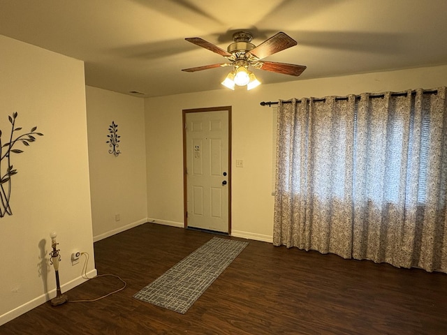 2841 10th St, Rockford, IL 61108 - spare room with dark wood finished floors and a ceiling fan