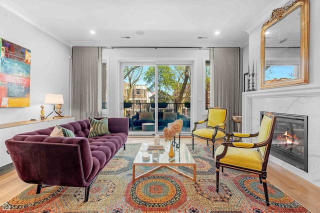 1469 W Byron St Unit 2, Chicago, IL 60613 - living area with wood finished floors, a glass covered fireplace, recessed lighting, and ornamental molding