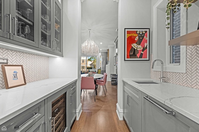 1469 W Byron St Unit 2, Chicago, IL 60613 - bar with wine cooler, tasteful backsplash, a chandelier, dishwasher, and parquet flooring