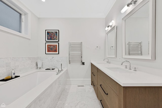 1469 W Byron St Unit 2, Chicago, IL 60613 - full bath with a towel warming rack, a garden tub, double vanity, radiator, and marble finish floors