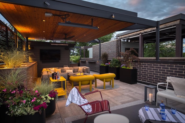 1469 W Byron St Unit 2, Chicago, IL 60613 - view of patio / terrace with an outdoor living space with a fireplace and a ceiling fan
