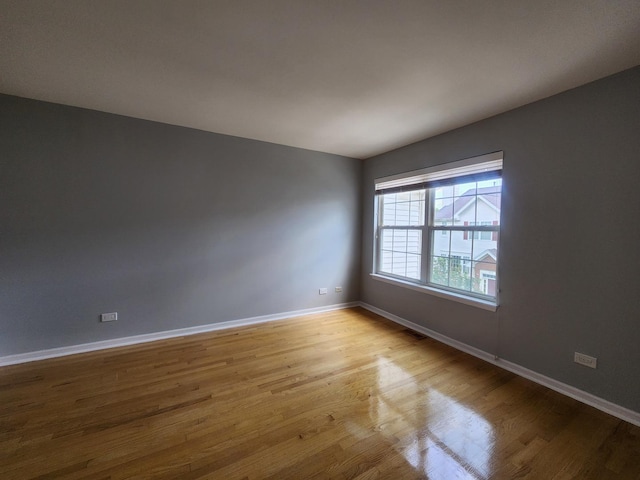 746 River Mill Parkway, Wheeling, IL 60090 - empty room featuring wood finished floors and baseboards