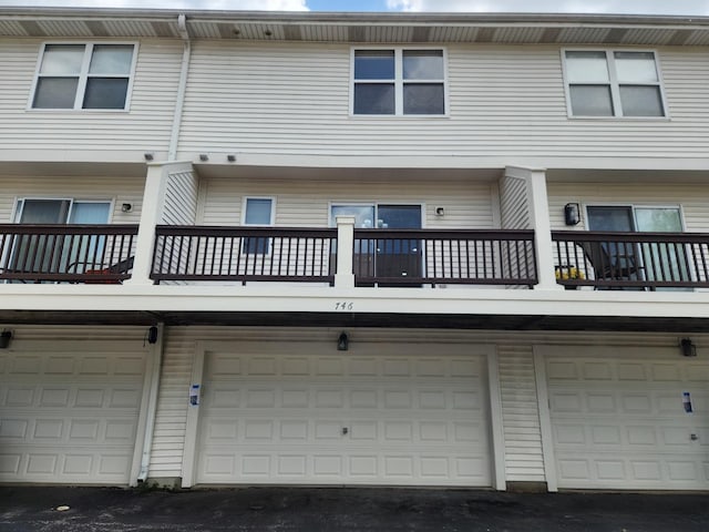 746 River Mill Parkway, Wheeling, IL 60090 - rear view of house featuring a balcony and an attached garage