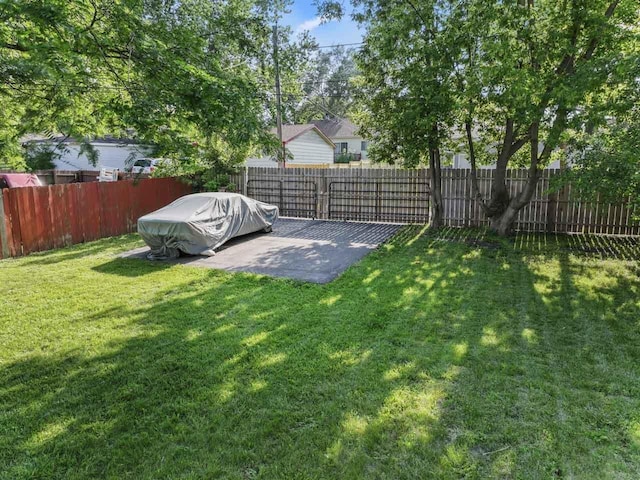 2110 Joanna Ave, Zion, IL 60099 - fenced backyard with a patio