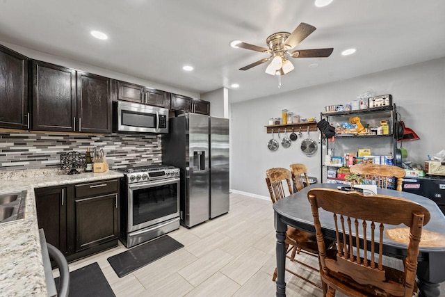 2110 Joanna Ave, Zion, IL 60099 - kitchen featuring stainless steel appliances, a ceiling fan, tasteful backsplash, recessed lighting, and light wood-type flooring