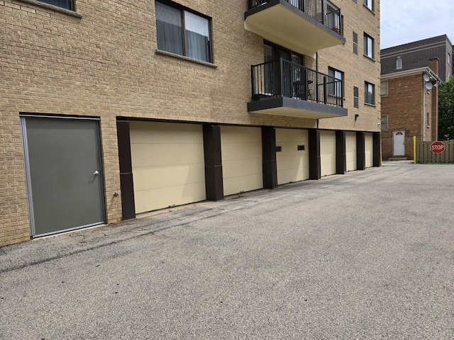 1441 E Thacker St Unit 501, Des Plaines, IL 60016 - view of building exterior featuring an attached garage