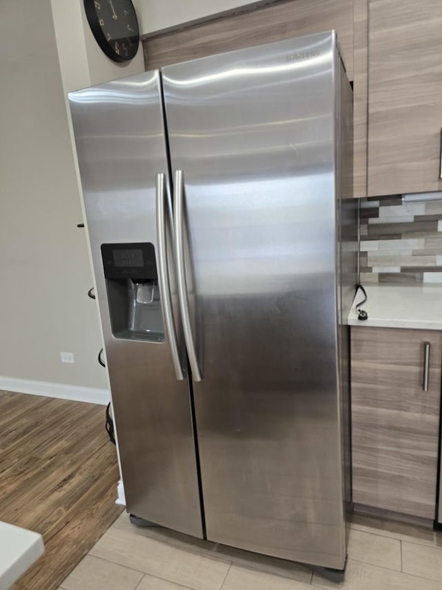 1441 E Thacker St Unit 501, Des Plaines, IL 60016 - detailed view of stainless steel fridge with ice dispenser, modern cabinets, and light countertops