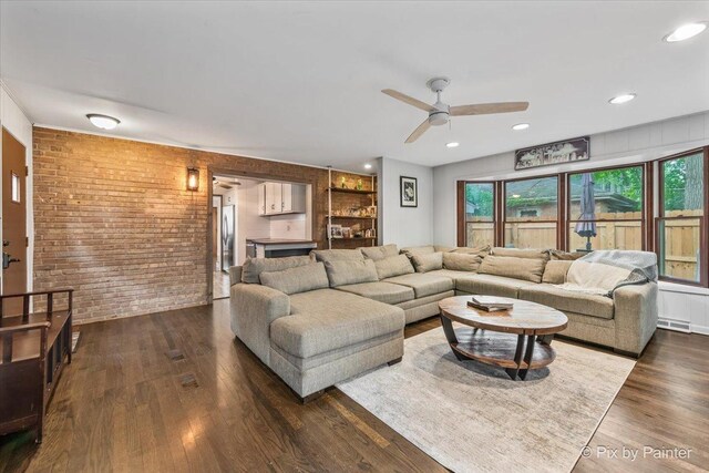 8920 Mcvicker Ave, Morton Grove, IL 60053 - living area featuring brick wall, a ceiling fan, dark wood-style floors, and built in features