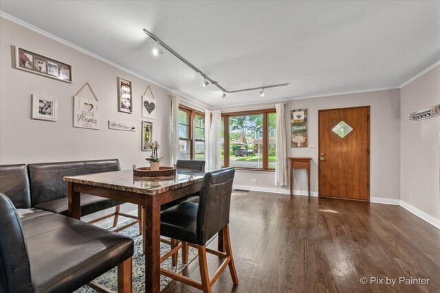 8920 Mcvicker Ave, Morton Grove, IL 60053 - dining space with track lighting, wood finished floors, and ornamental molding