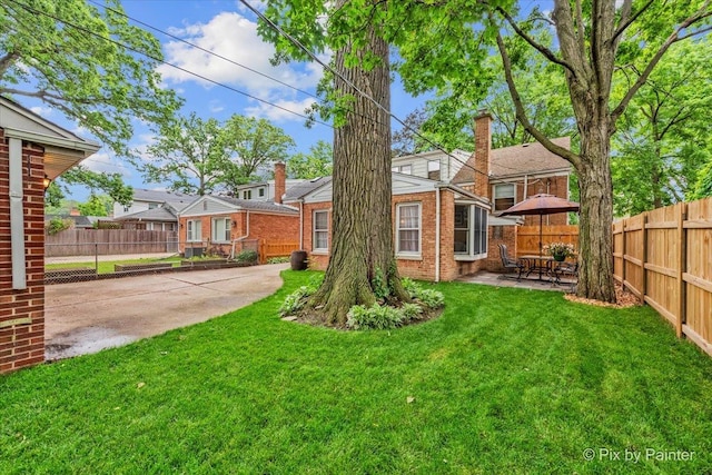 8920 Mcvicker Ave, Morton Grove, IL 60053 - rear view of property featuring a fenced backyard, a patio area, and brick siding