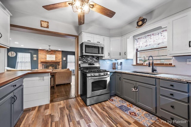 8920 Mcvicker Ave, Morton Grove, IL 60053 - kitchen featuring appliances with stainless steel finishes, ceiling fan, gray cabinetry, plenty of natural light, and recessed lighting