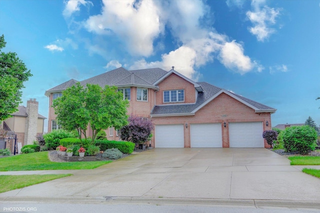 22450 Autumn Dr, Frankfort, IL 60423 - traditional-style home featuring driveway, brick siding, and a shingled roof