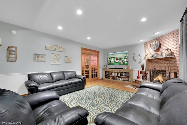 22450 Autumn Dr, Frankfort, IL 60423 - living room featuring wood finished floors, a brick fireplace, and recessed lighting
