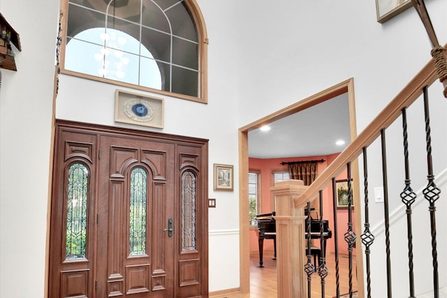 22450 Autumn Dr, Frankfort, IL 60423 - entryway with a high ceiling, light wood-style floors, stairs, and recessed lighting