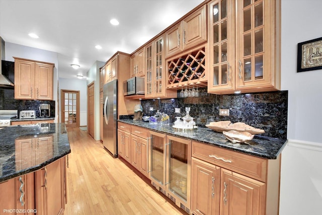 22450 Autumn Dr, Frankfort, IL 60423 - kitchen featuring wine cooler, appliances with stainless steel finishes, backsplash, light wood-style flooring, and dark stone counters