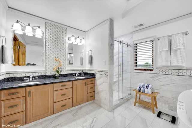22450 Autumn Dr, Frankfort, IL 60423 - bathroom featuring tile walls, a shower stall, double vanity, crown molding, and a wainscoted wall