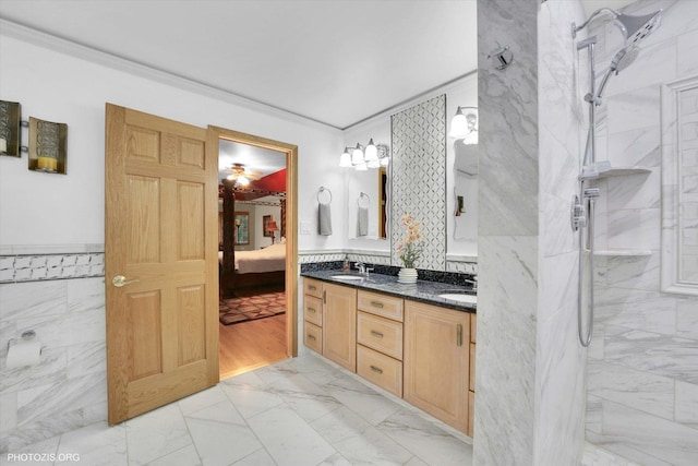 22450 Autumn Dr, Frankfort, IL 60423 - ensuite bathroom with marble look tile flooring, double vanity, ornamental molding, a marble finish shower, and tile walls