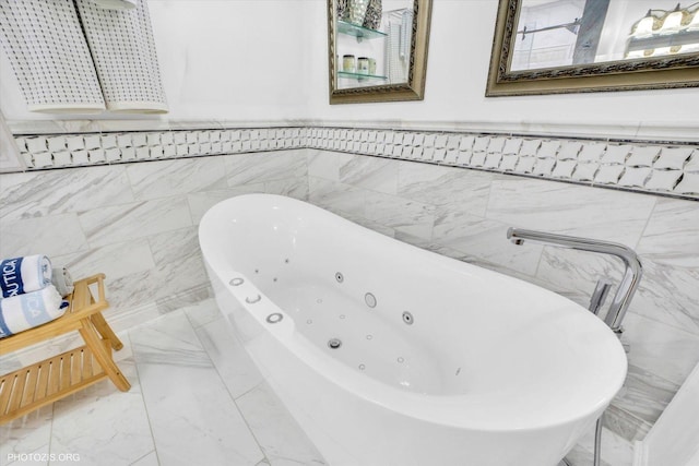 22450 Autumn Dr, Frankfort, IL 60423 - bathroom with a tub with jets, marble finish floors, tile walls, and a wainscoted wall