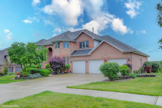 22450 Autumn Dr, Frankfort, IL 60423 - traditional-style house with brick siding, concrete driveway, and a front lawn