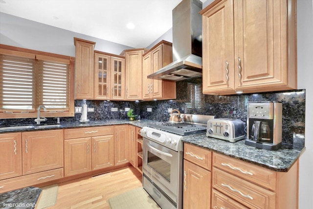22450 Autumn Dr, Frankfort, IL 60423 - kitchen featuring gas range, wall chimney exhaust hood, dark stone countertops, light wood-style floors, and tasteful backsplash