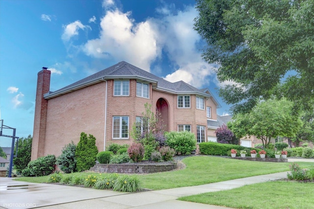 22450 Autumn Dr, Frankfort, IL 60423 - traditional home featuring brick siding, a chimney, and a front lawn
