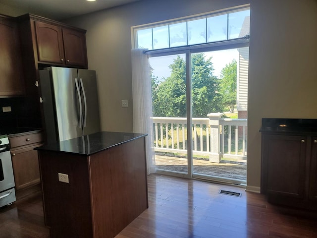 3144 Taunton St Unit 3144, Elgin, IL 60124 - kitchen with freestanding refrigerator, dark wood-style floors, and a center island