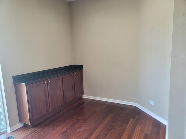 3144 Taunton St Unit 3144, Elgin, IL 60124 - spare room featuring dark wood-style flooring
