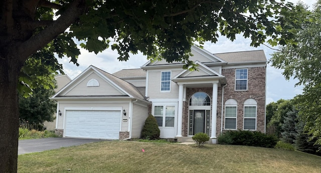 1545 Coral Dr, Yorkville, IL 60560 - view of front of property featuring asphalt driveway, a front lawn, brick siding, a garage, and a shingled roof