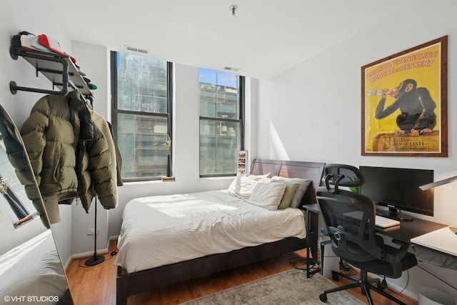 740 S Federal St Unit 1106, Chicago, IL 60605 - bedroom featuring wood finished floors and a desk