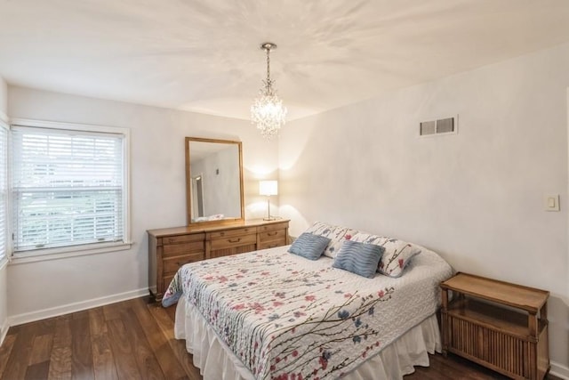 7350 Lavergne Ave, Skokie, IL 60077 - bedroom featuring dark wood-style flooring and a chandelier
