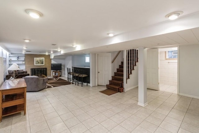 7350 Lavergne Ave, Skokie, IL 60077 - basement with a brick fireplace, stairway, light tile patterned floors, and healthy amount of natural light