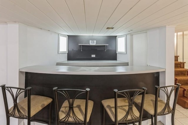 7350 Lavergne Ave, Skokie, IL 60077 - indoor dry bar featuring healthy amount of natural light, stairs, and tile patterned floors