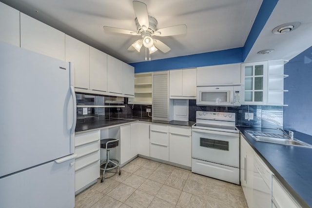 4524 Kings Walk Dr Unit 2A, Rolling Meadows, IL 60008 - kitchen with white appliances, open shelves, dark countertops, backsplash, and ceiling fan