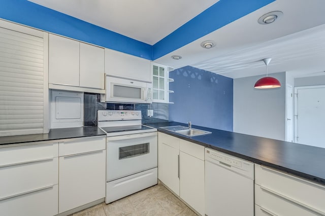 4524 Kings Walk Dr Unit 2A, Rolling Meadows, IL 60008 - kitchen featuring white appliances, white cabinets, dark countertops, decorative backsplash, and hanging light fixtures