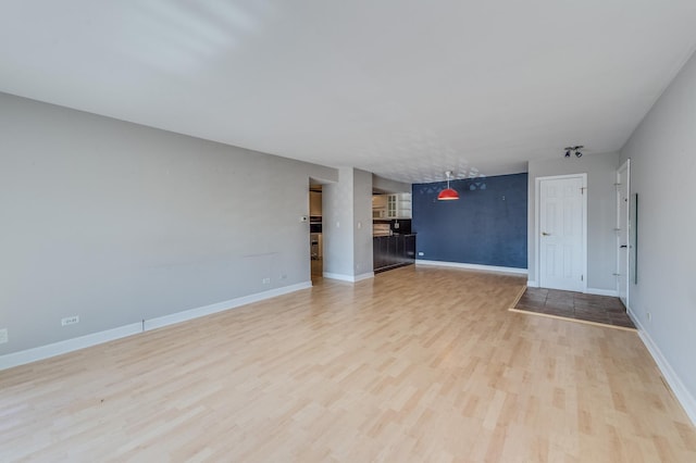 4524 Kings Walk Dr Unit 2A, Rolling Meadows, IL 60008 - unfurnished living room featuring light wood-style floors and baseboards