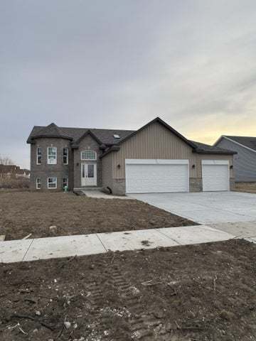 8301 Dylan Dr, Merrillville, IN 46410 - view of front of property with a garage and driveway