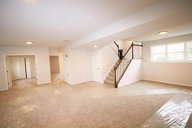 8301 Dylan Dr, Merrillville, IN 46410 - carpeted spare room featuring stairway and baseboards