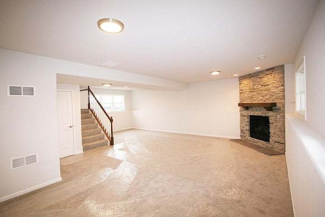 8301 Dylan Dr, Merrillville, IN 46410 - unfurnished living room featuring carpet, stairway, and a fireplace