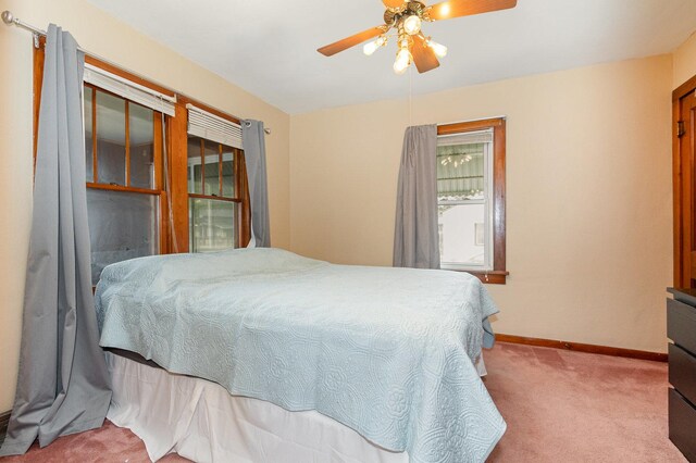 1814 E Washington St, Joliet, IL 60433 - carpeted bedroom featuring baseboards and a ceiling fan