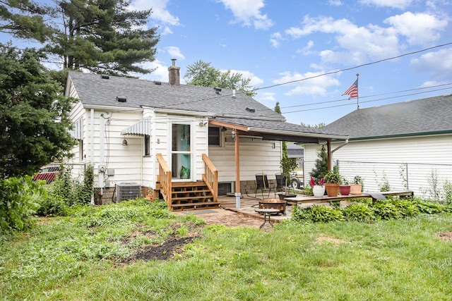 1814 E Washington St, Joliet, IL 60433 - rear view of house with a chimney, a shingled roof, entry steps, and a patio