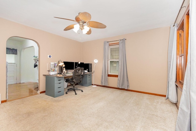 1814 E Washington St, Joliet, IL 60433 - home office featuring carpet floors, arched walkways, and a ceiling fan
