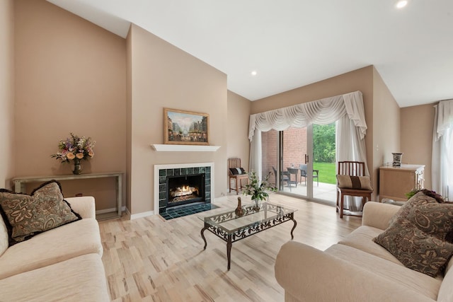 2S570 Patrick Henry Sq Unit 119, Oak Brook, IL 60523 - living area featuring wood finished floors, a fireplace, recessed lighting, and high vaulted ceiling