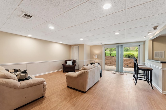 2S570 Patrick Henry Sq Unit 119, Oak Brook, IL 60523 - living area with wood finished floors, a paneled ceiling, and recessed lighting