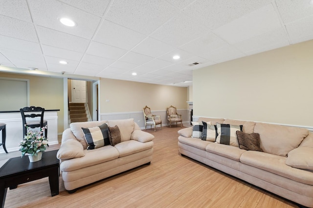 2S570 Patrick Henry Sq Unit 119, Oak Brook, IL 60523 - living area with a paneled ceiling, wood finished floors, recessed lighting, and stairway