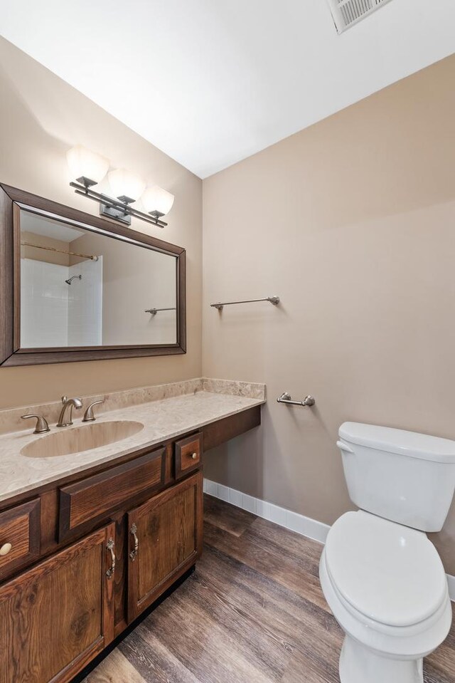 2S570 Patrick Henry Sq Unit 119, Oak Brook, IL 60523 - bathroom with vanity and wood finished floors