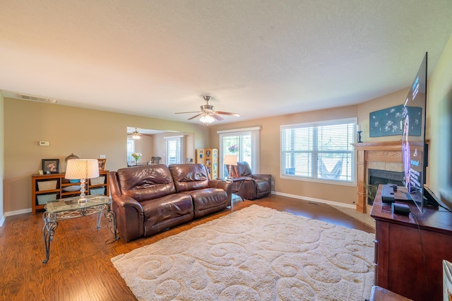 1715 W River St Unit 1715, Dixon, IL 61021 - living room featuring a tile fireplace, wood finished floors, and ceiling fan