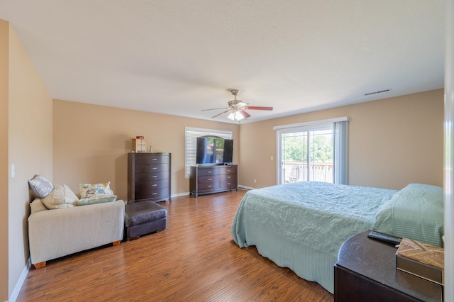 1715 W River St Unit 1715, Dixon, IL 61021 - bedroom featuring wood finished floors, access to outside, and a ceiling fan